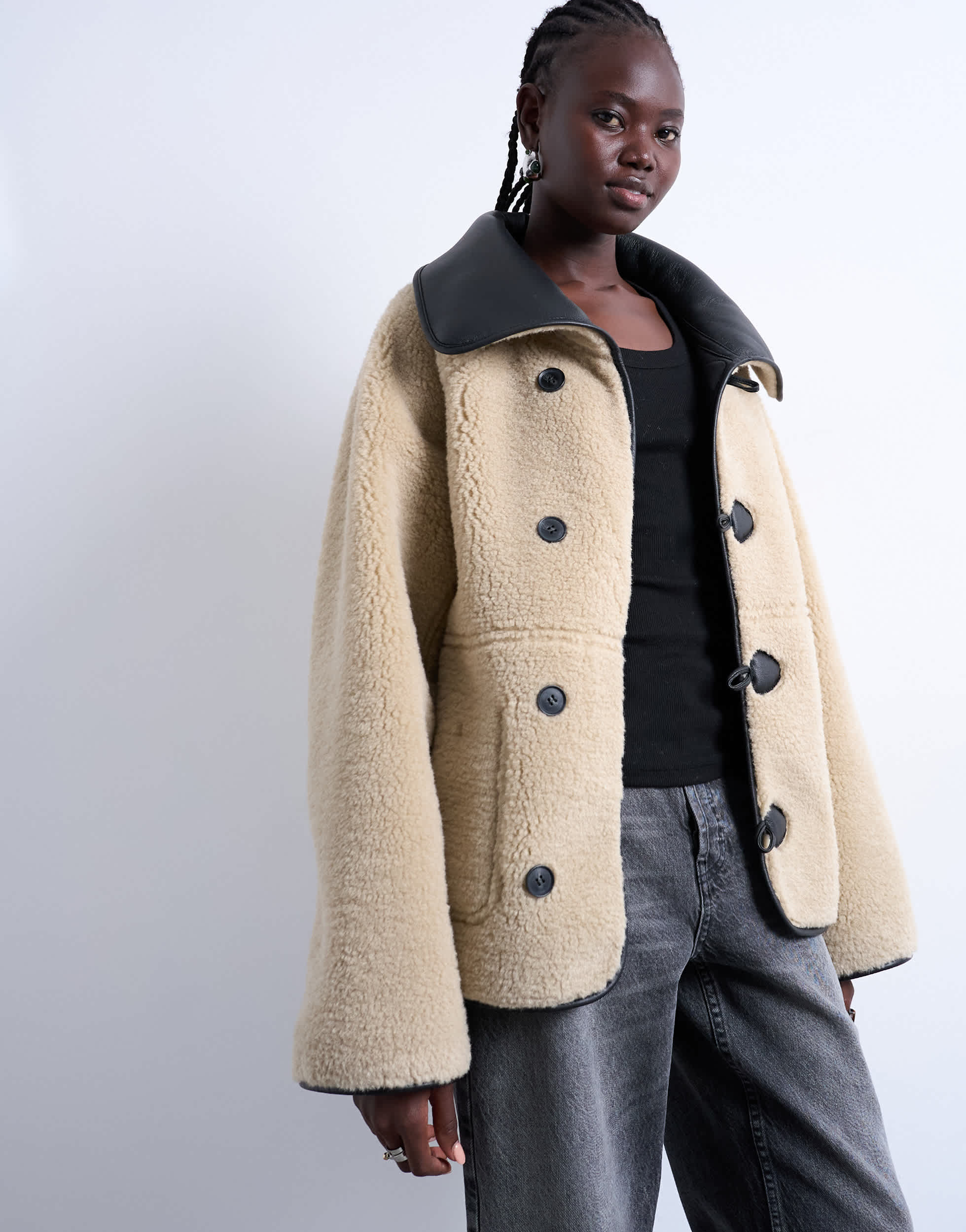Topshop shearling oversized reversible coat with button loop in black and cream