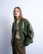 Topshop faux leather vintage wash oversized collarless bomber jacket in green