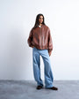 Topshop faux leather vintage wash oversized collarless bomber jacket in tan