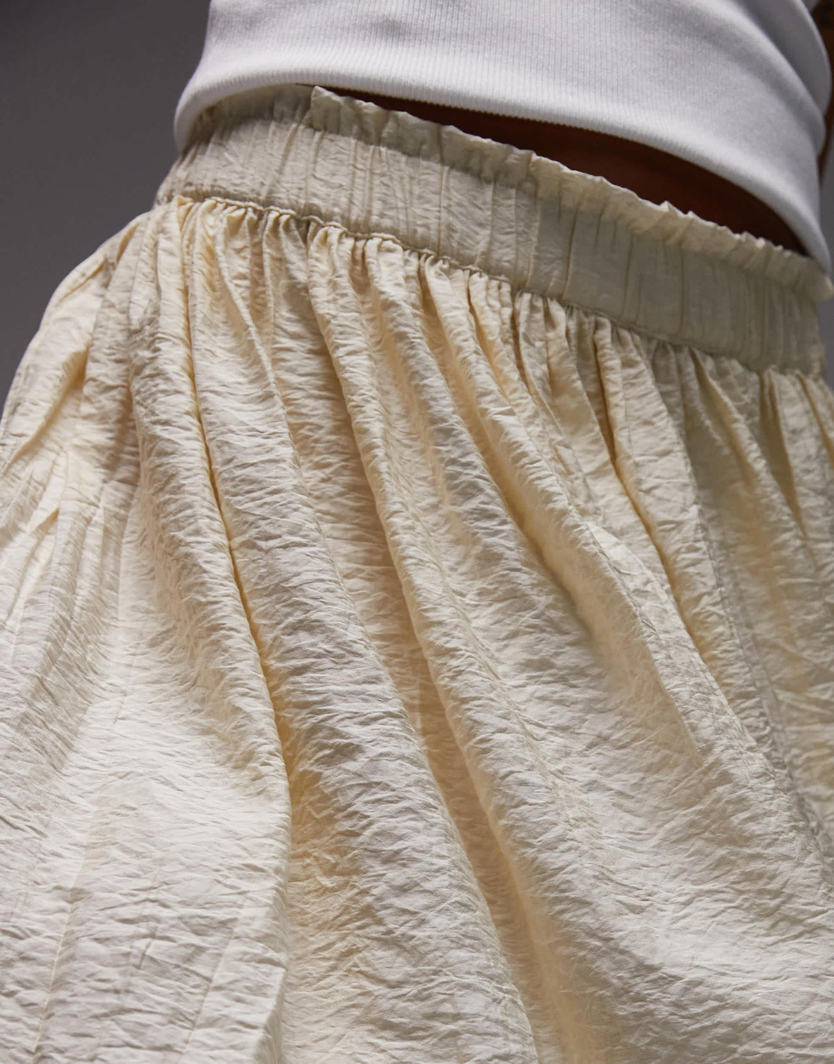 Topshop flippy crinkle mini skirt in sand