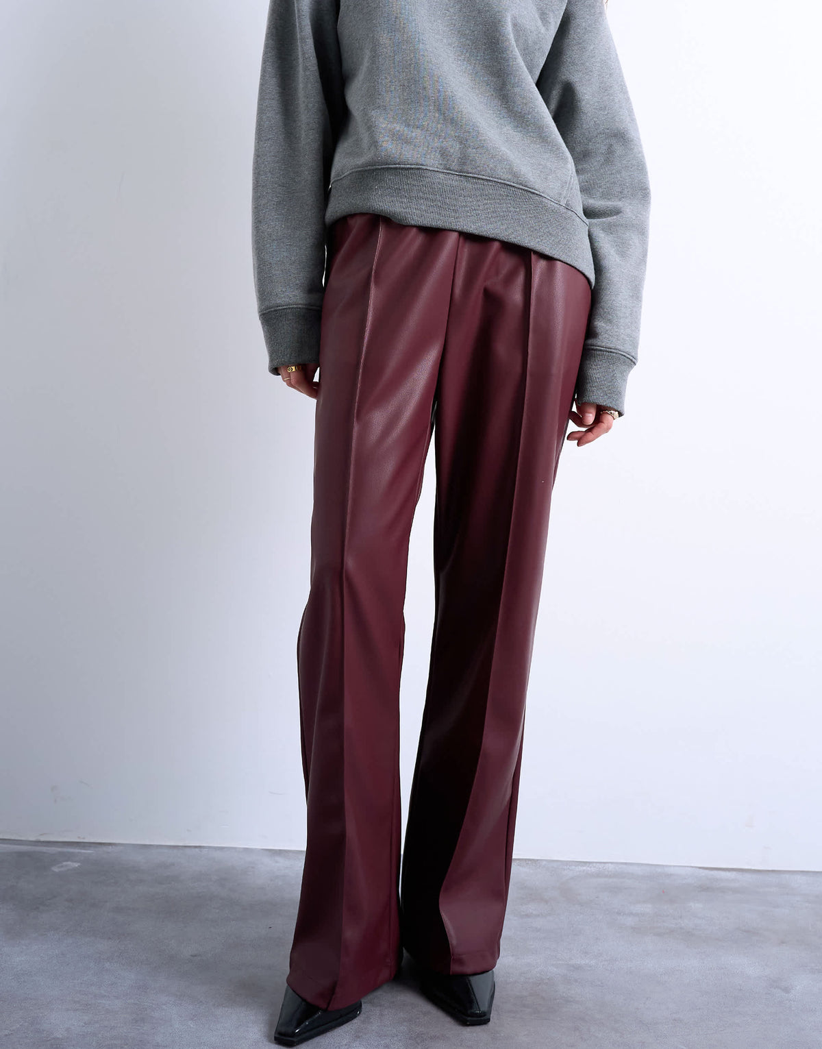 Topshop faux leather wide leg jogger with pinseam detail in burgundy