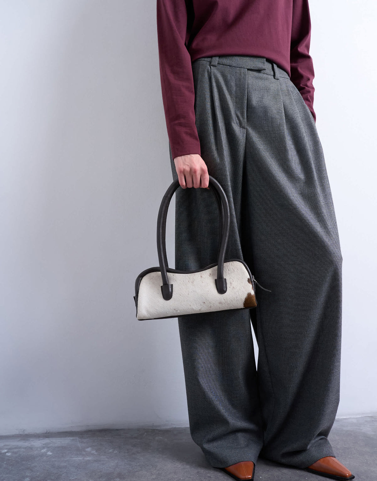 Topshop Sullivan hair on real leather shoulder bowler bag in cow print 