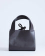 Topshop Sandy small real suede and leather grab bag with tie fastening in chocolate