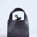 Topshop Sandy small real suede and leather grab bag with tie fastening in chocolate