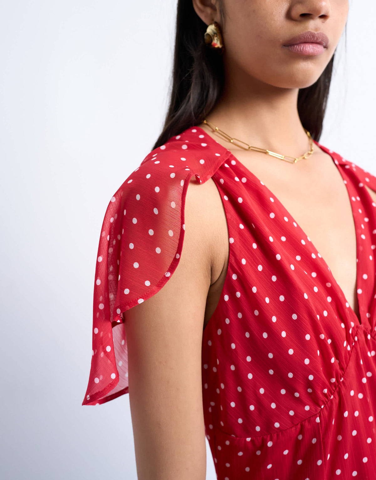 Topshop cape sleeve godet hem mini dress in red based spot