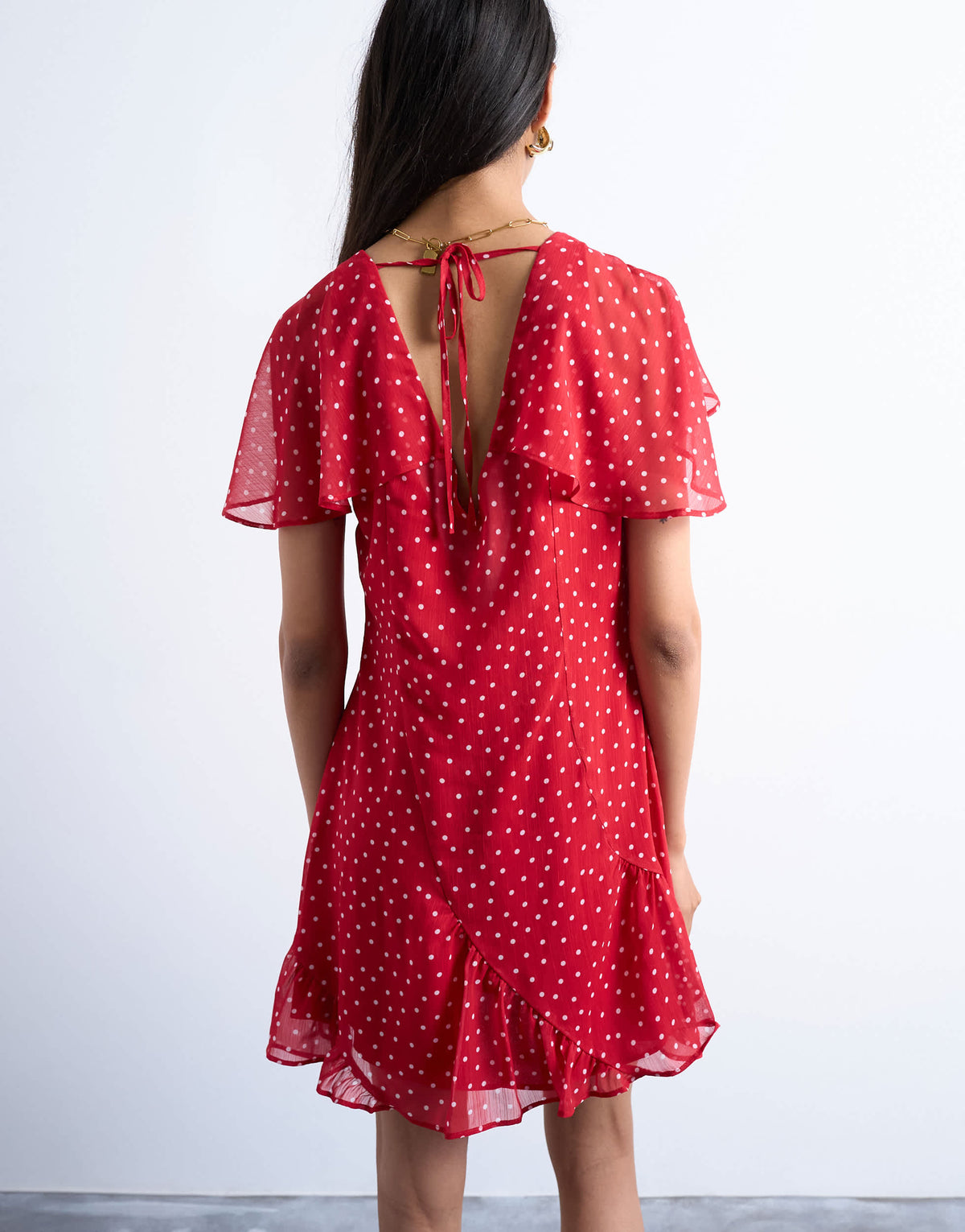 Topshop cape sleeve godet hem mini dress in red based spot