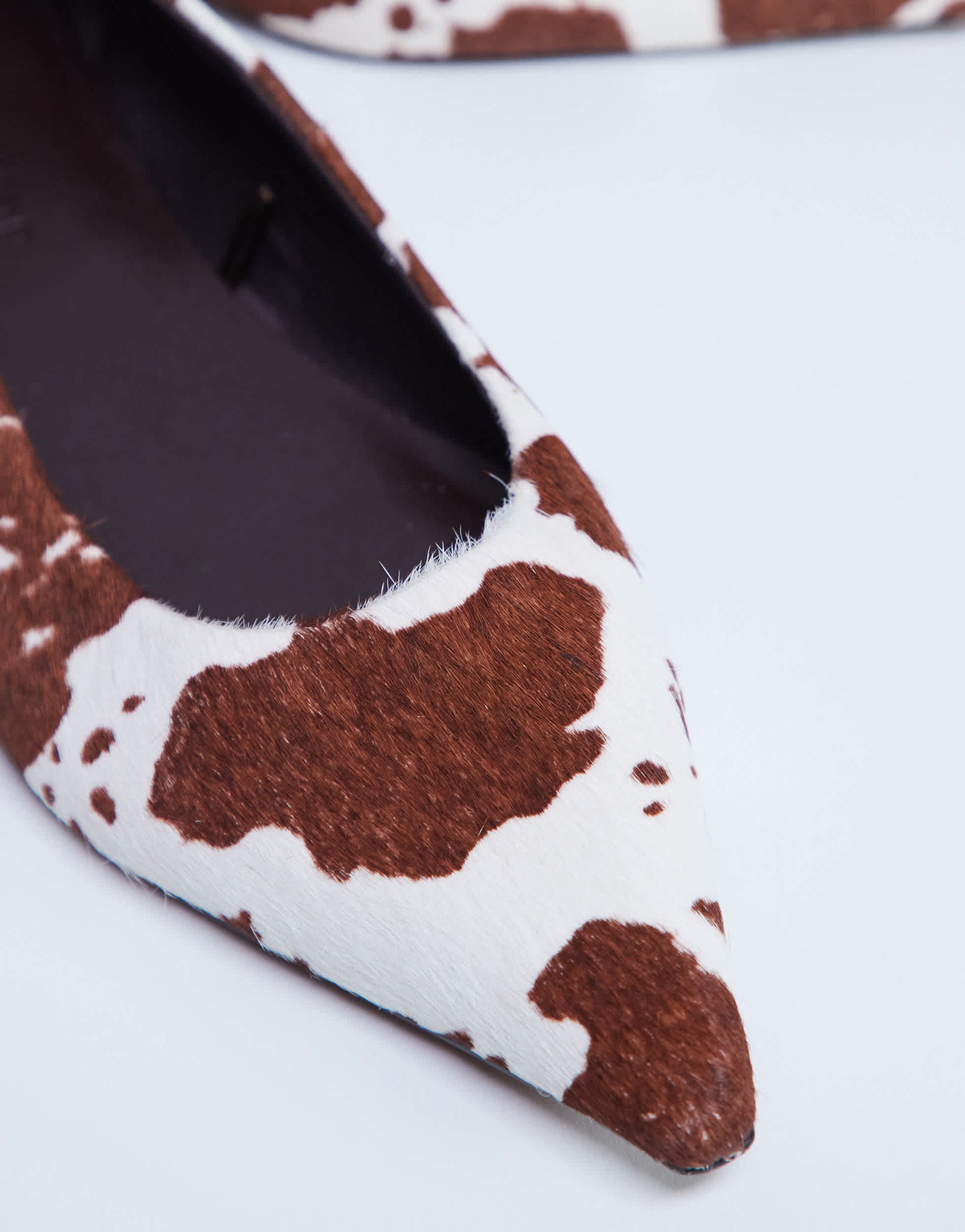 Topshop Ace point toe flat shoe in cow print hair on real leather 