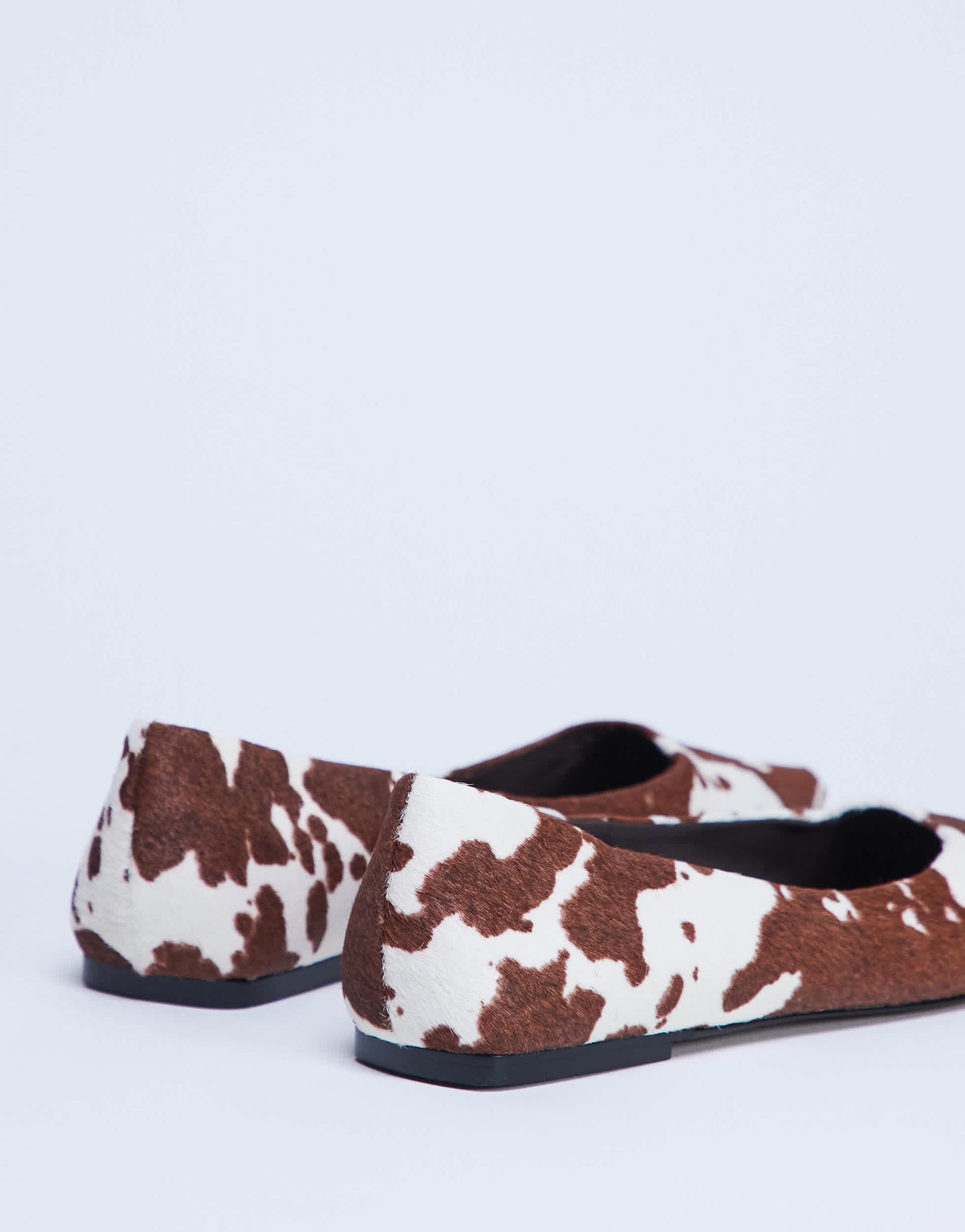Topshop Ace point toe flat shoe in cow print hair on real leather 