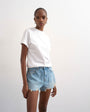 Topshop denim A-line shorts with rip in bleach