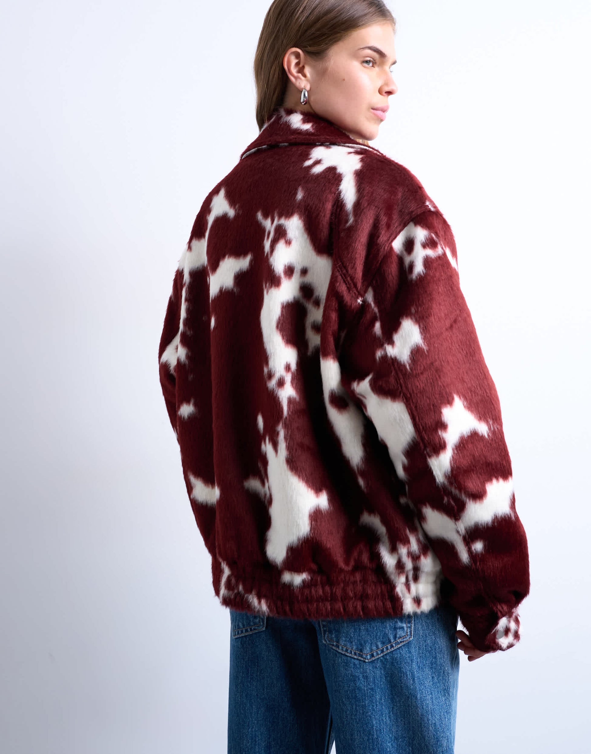 Topshop faux fur cow print bomber jacket