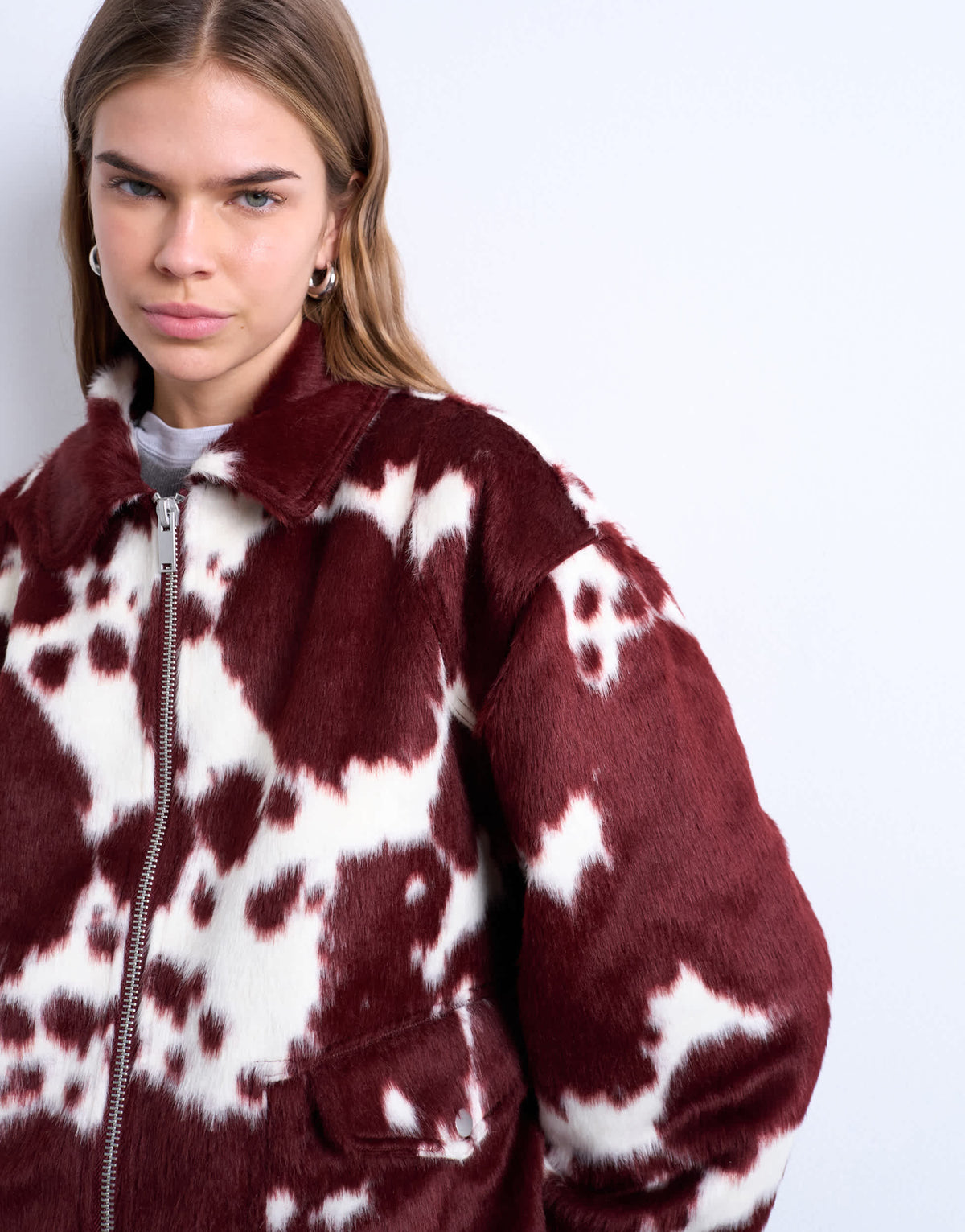 Topshop faux fur cow print bomber jacket