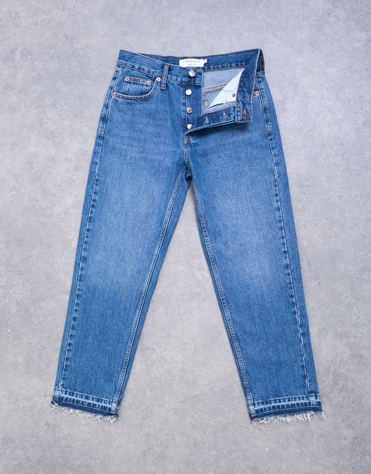Topshop Runway mid rise straight cropped jean with let down hem detail in vintage blue
