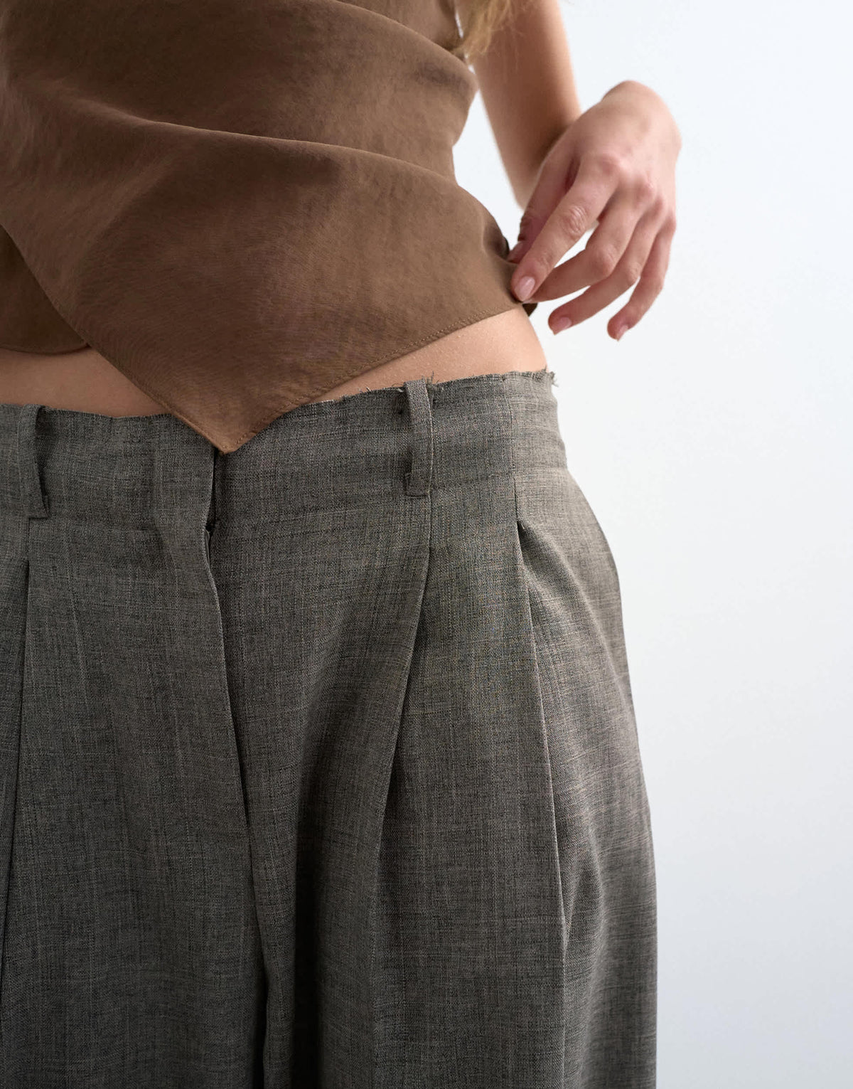 Topshop raw hem low slung double pleated tailored trouser in brown marl