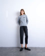 Topshop Runway mid rise straight cropped jean with let down hem detail in washed black