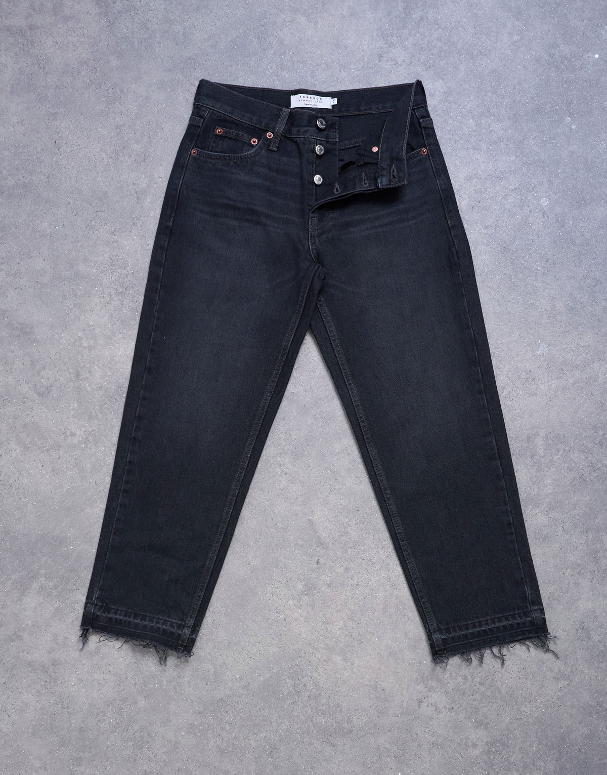 Topshop Runway mid rise straight cropped jean with let down hem detail in washed black