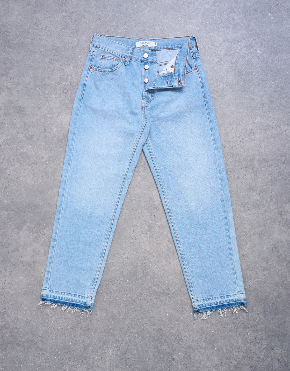 Topshop Runway mid rise straight cropped jean with let down hem detail in bleach