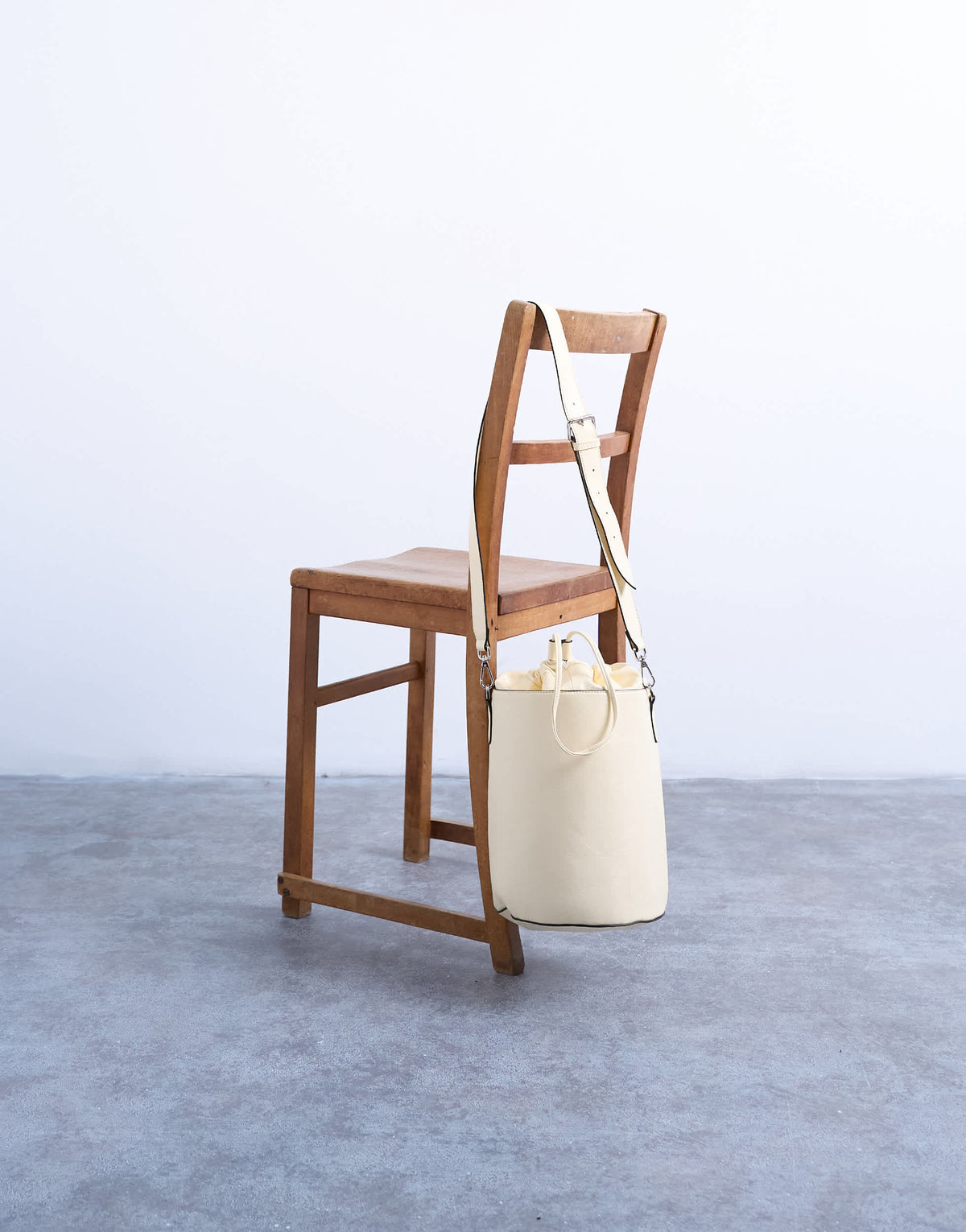 Topshop Carla large cross body bucket bag in buttermilk