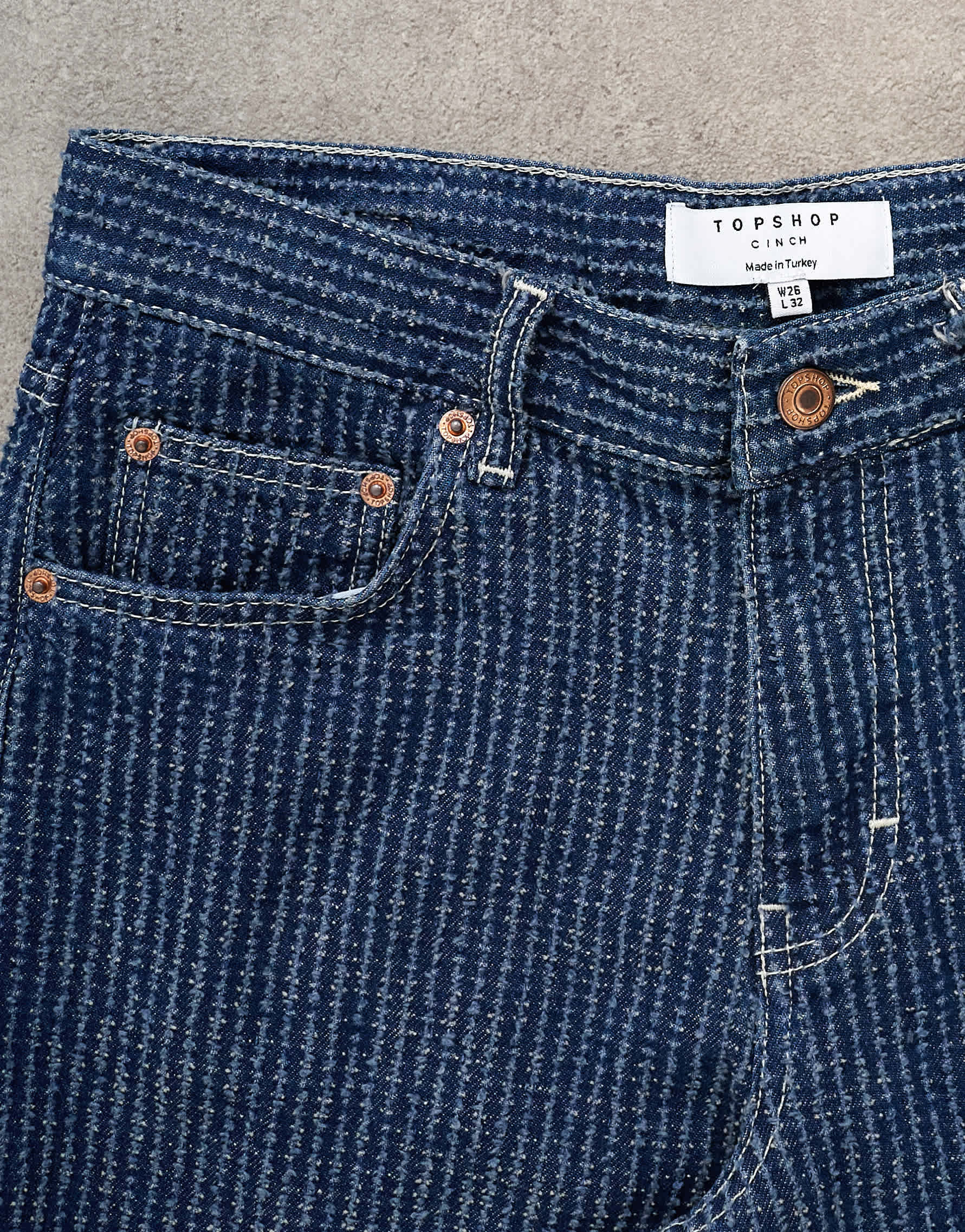 Topshop Cinch low rise jean in textured stripe detail indigo rinse