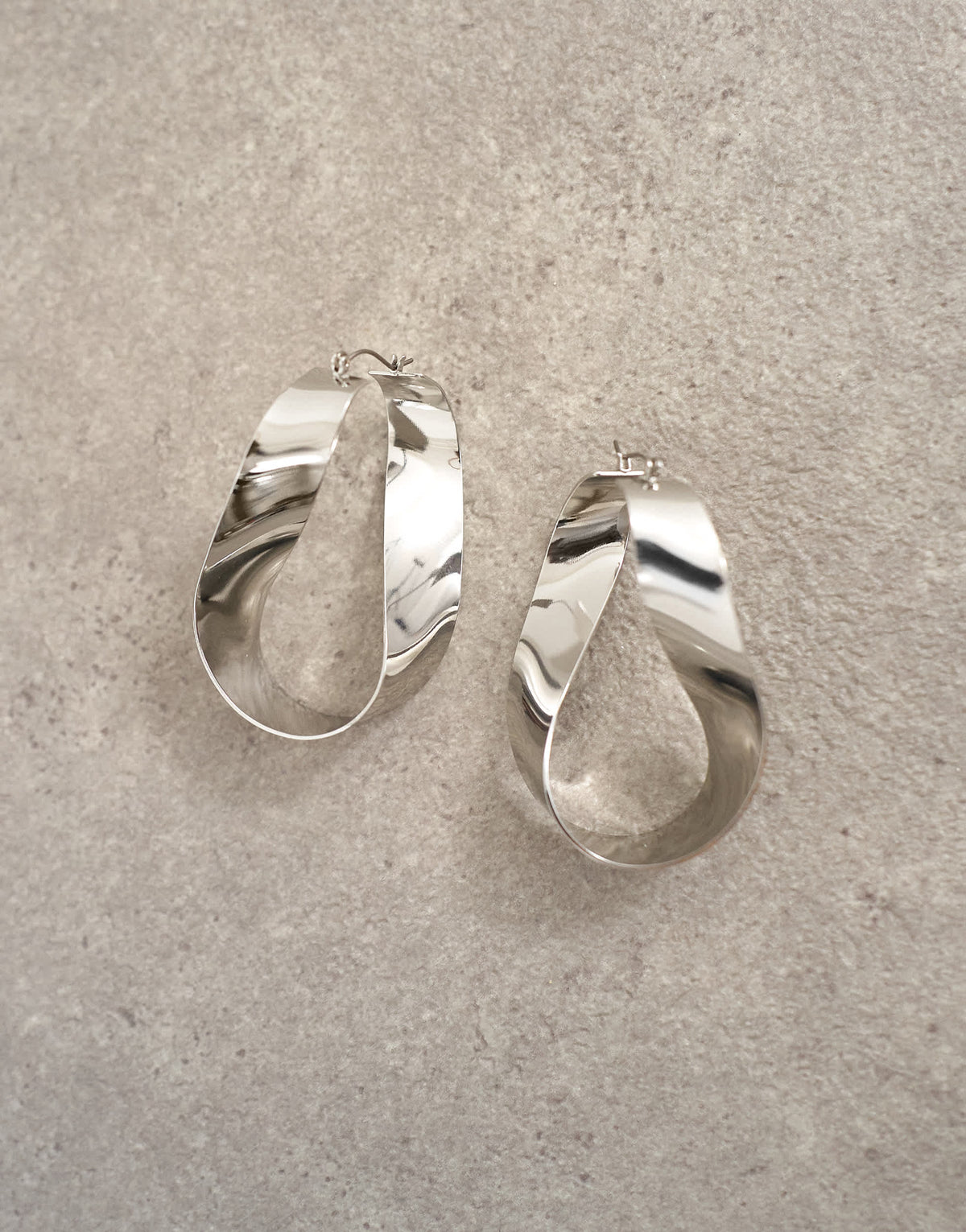 Topshop Charlotte twisted hoop earring in silver tone