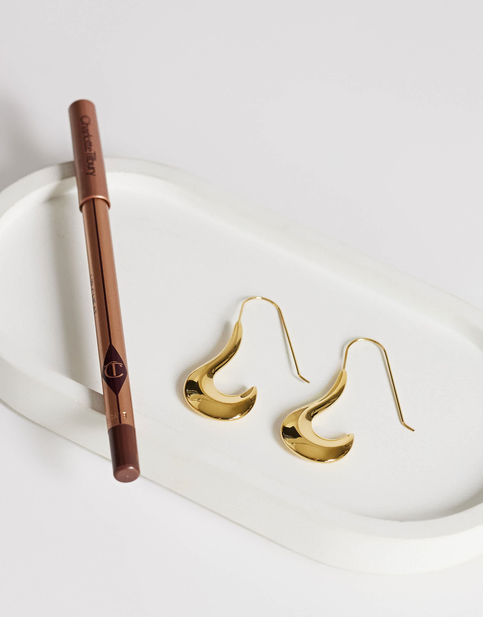 Topshop Claudia waterproof wavy drop hoop earrings in stainless gold