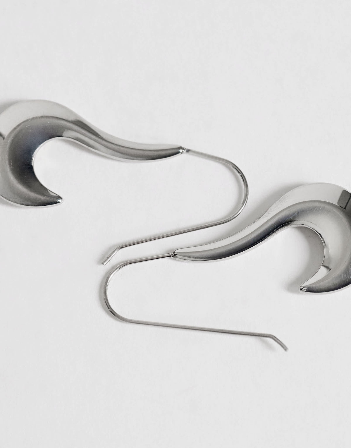 Topshop Claudia waterproof wavy drop hoop earrings in stainless silver