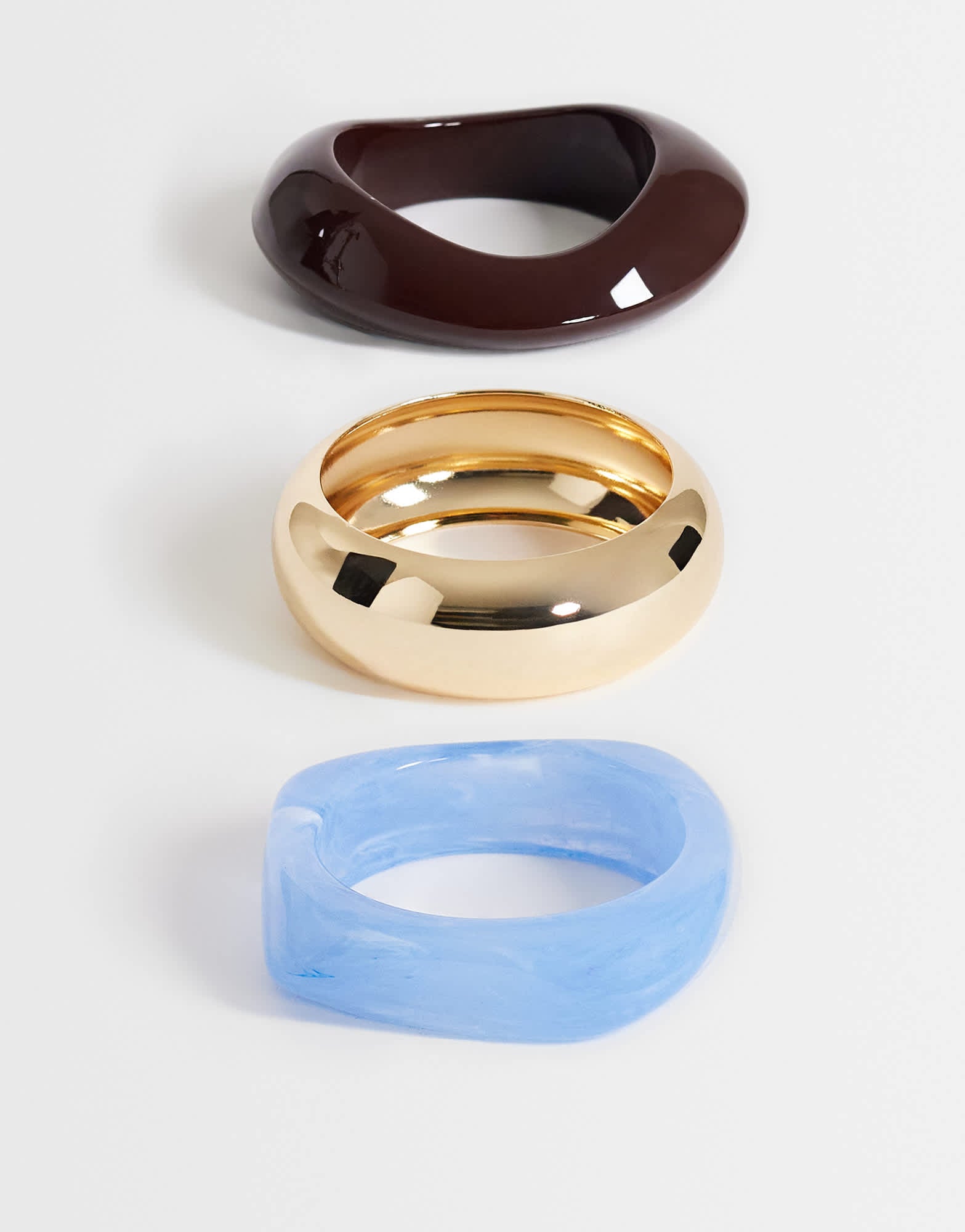 Topshop Finn 3 pack resin bangles in gold, blue and brown