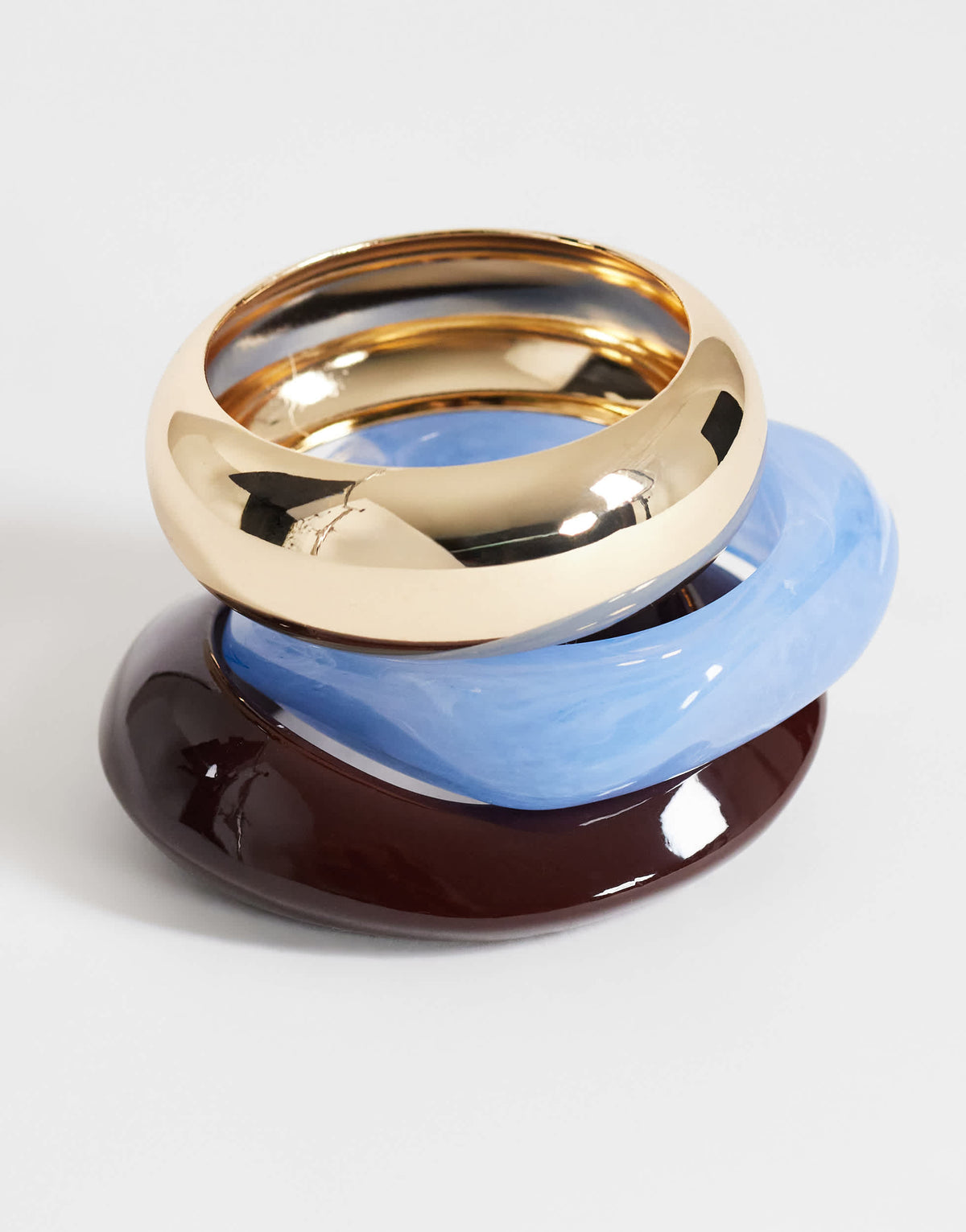 Topshop Finn 3 pack resin bangles in gold, blue and brown