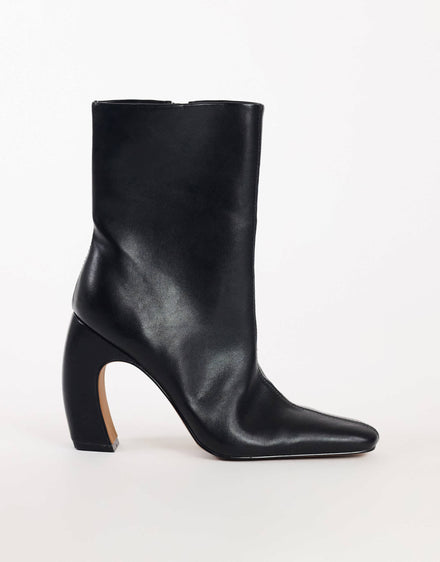 Topshop Karter curved heel ankle boot in black stretch faux leather