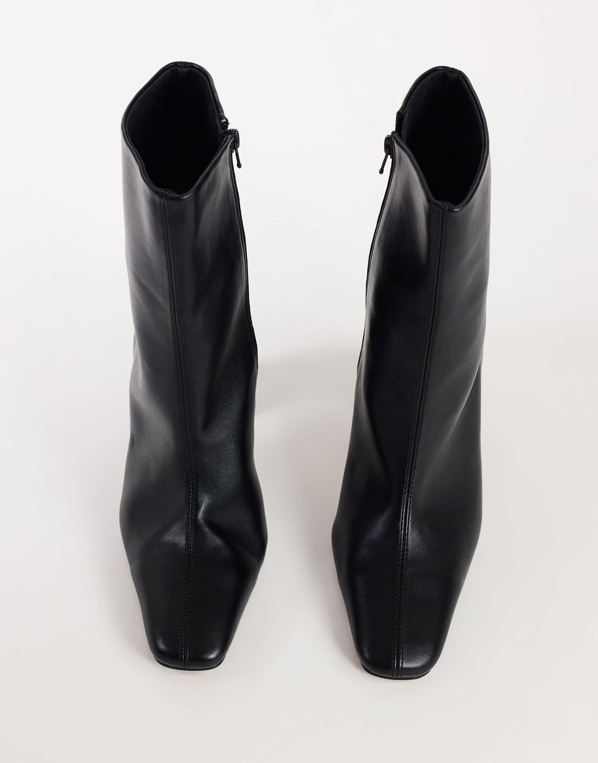 Topshop Karter curved heel ankle boot in black stretch faux leather