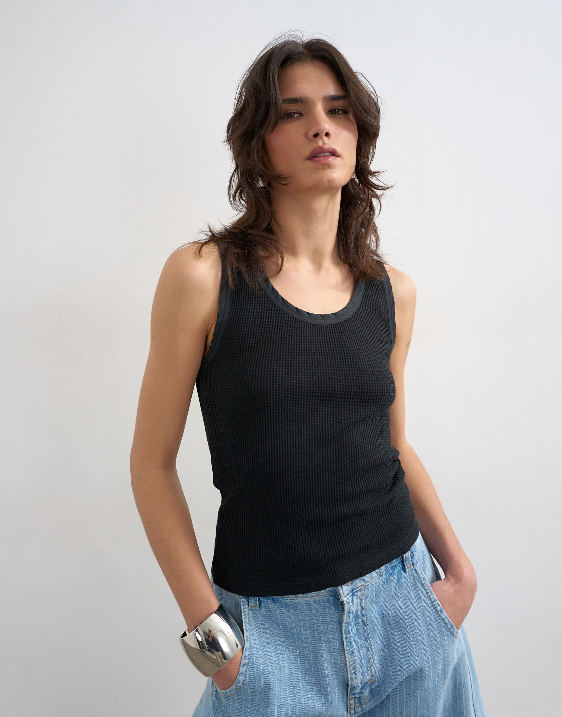 Topshop washed waffle vest with woven trim in washed black