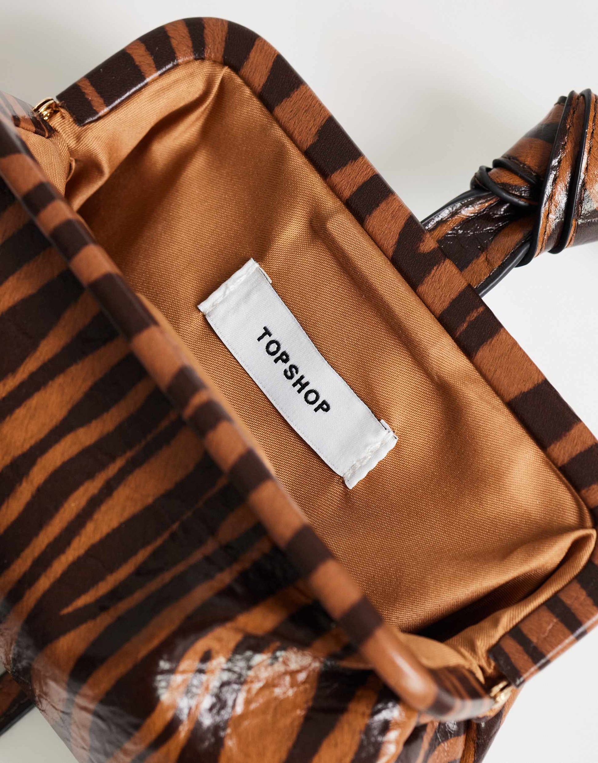 Topshop Jade mini wristlet grab bag in tiger print
