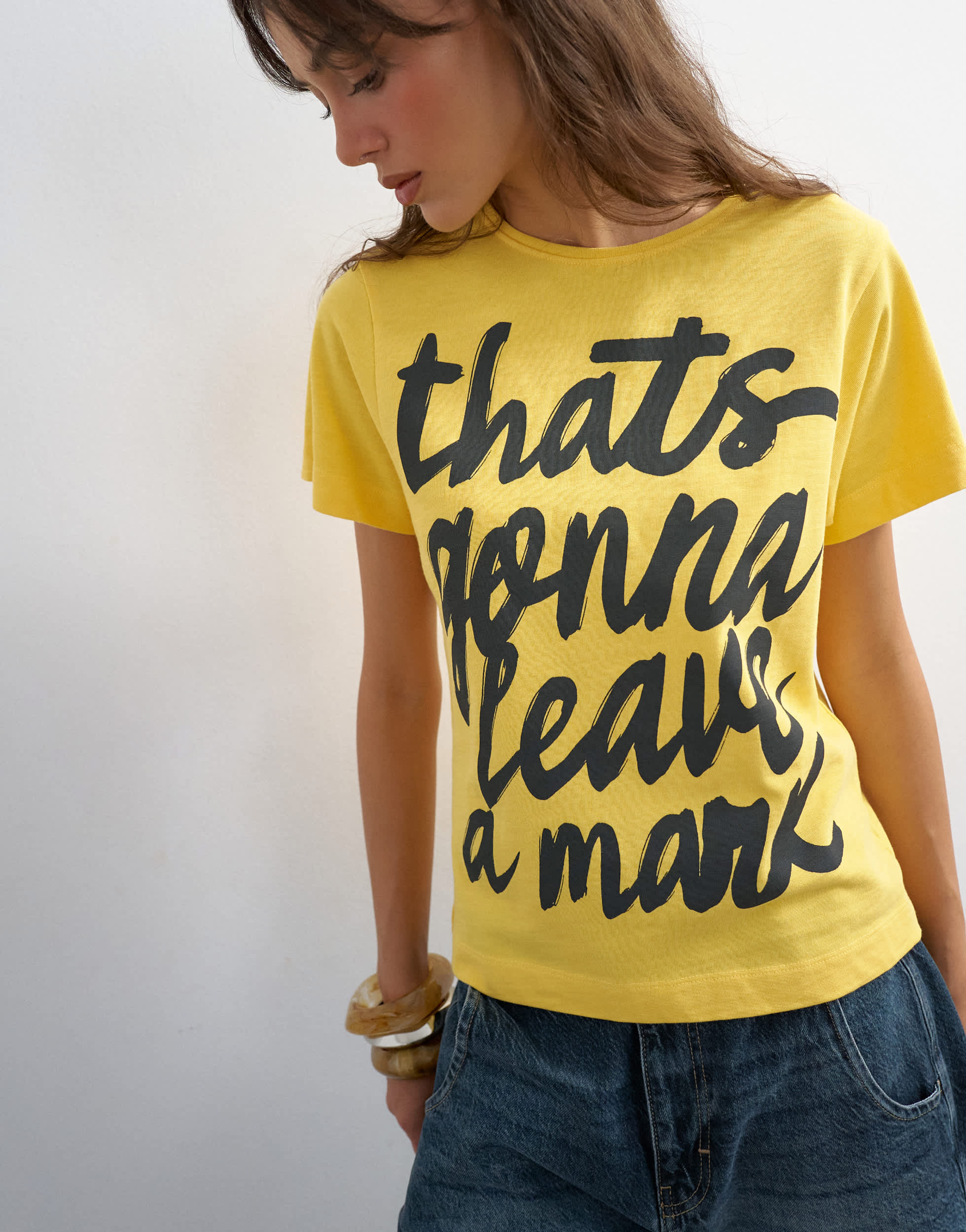 Topshop 'That's Gonna Leave A Mark' graphic tee in yellow