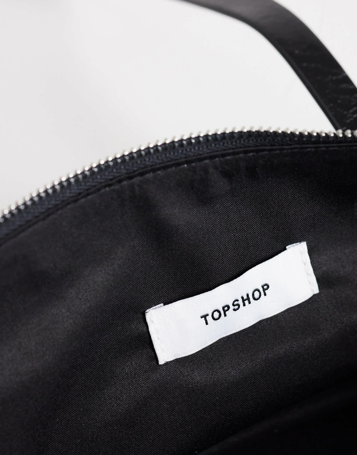 Topshop Snoopy small zip front pocket shoulder bag in black