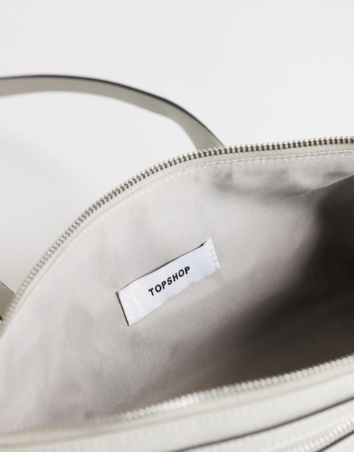 Topshop Snoopy small zip front pocket shoulder bag in light grey