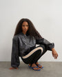 Topshop faux leather oversized zip up bomber jacket in washed black