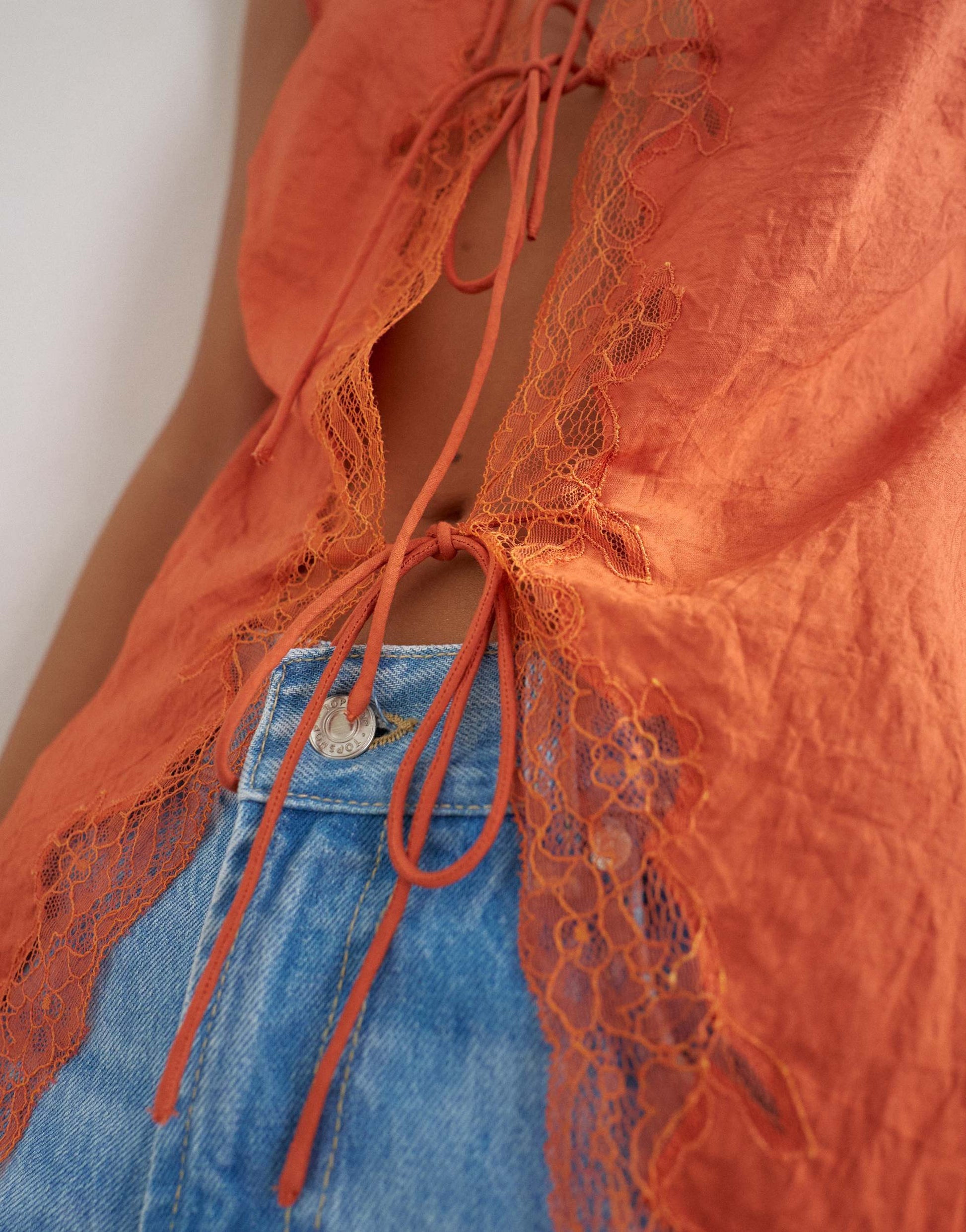 Topshop cap sleeve asymmetric tie front lace detail top in rust