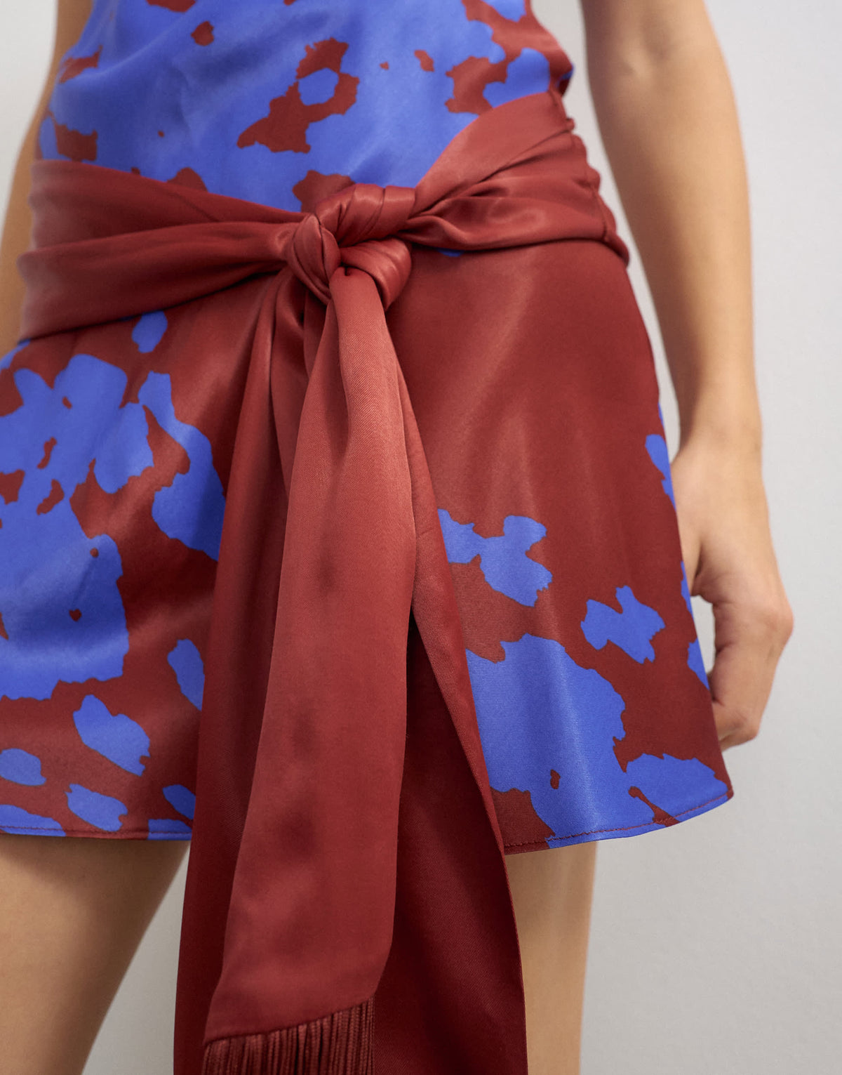Topshop satin scoop neck dropped waist mini dress with fringed tie in burgundy and blue abstract print