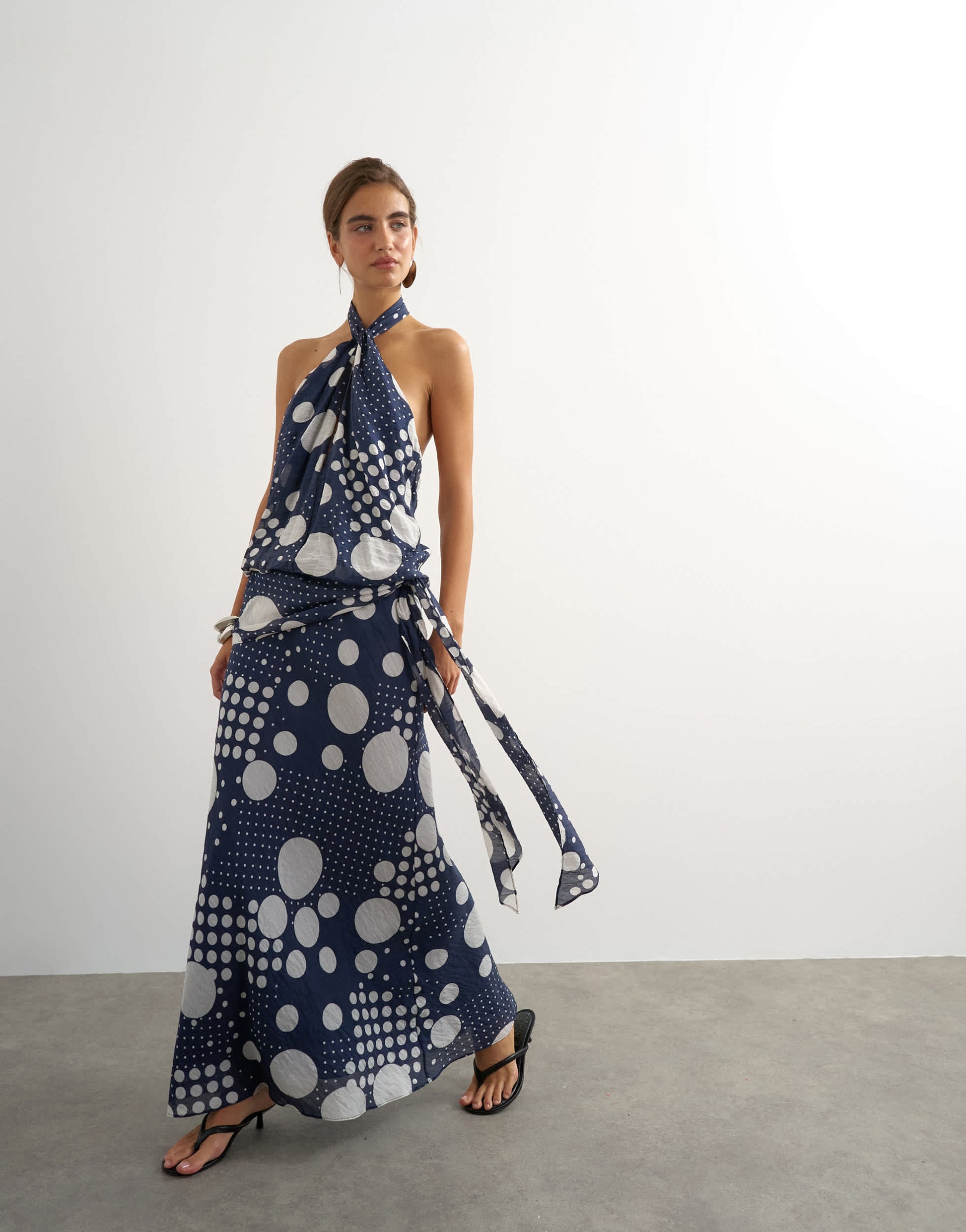Topshop halter neck dropped waist tie detail maxi dress in navy mixed spot