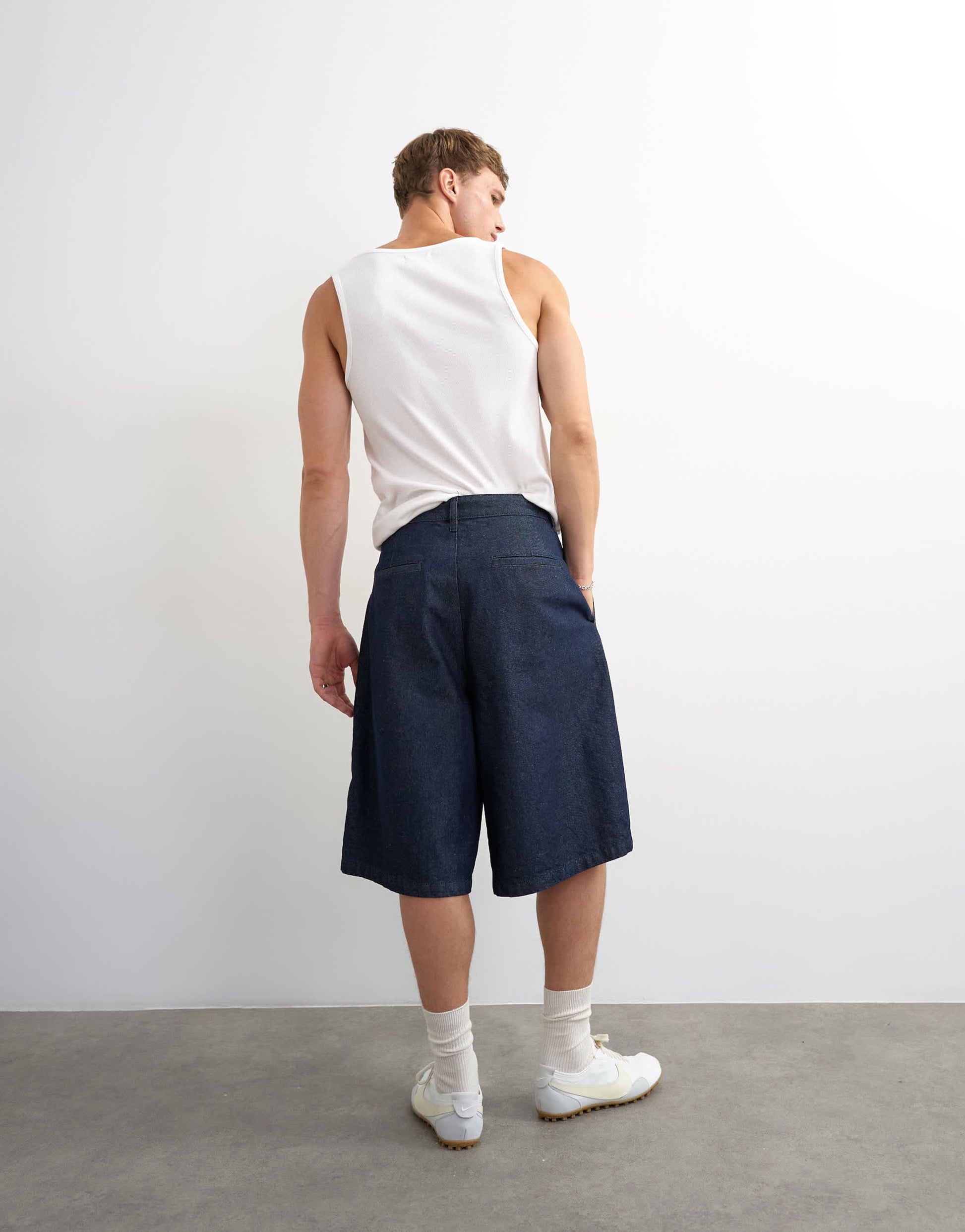 Topman wide leg denim bermuda short with pronounced pleat in mid-wash blue