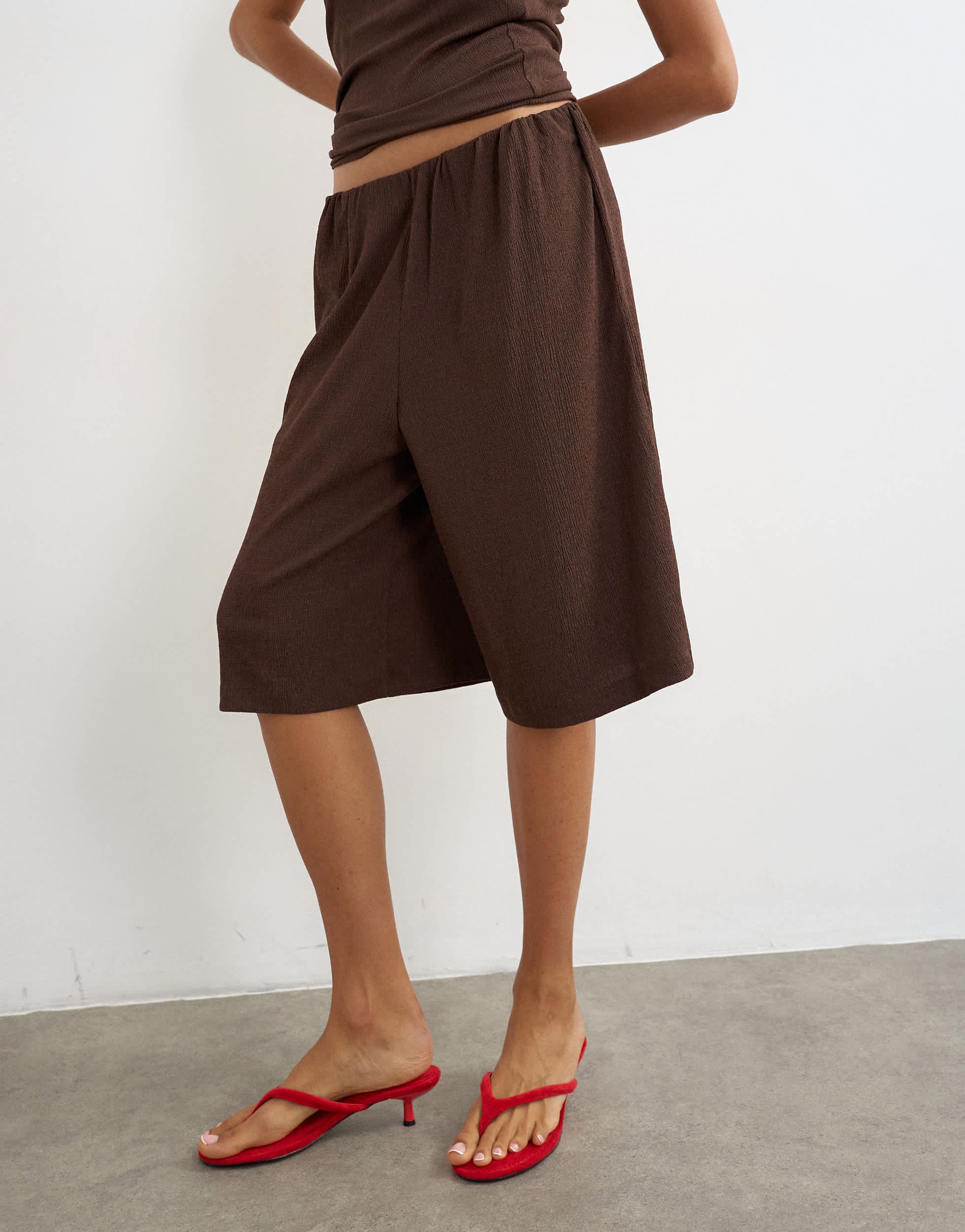 Topshop crinkle long line board shorts in chocolate