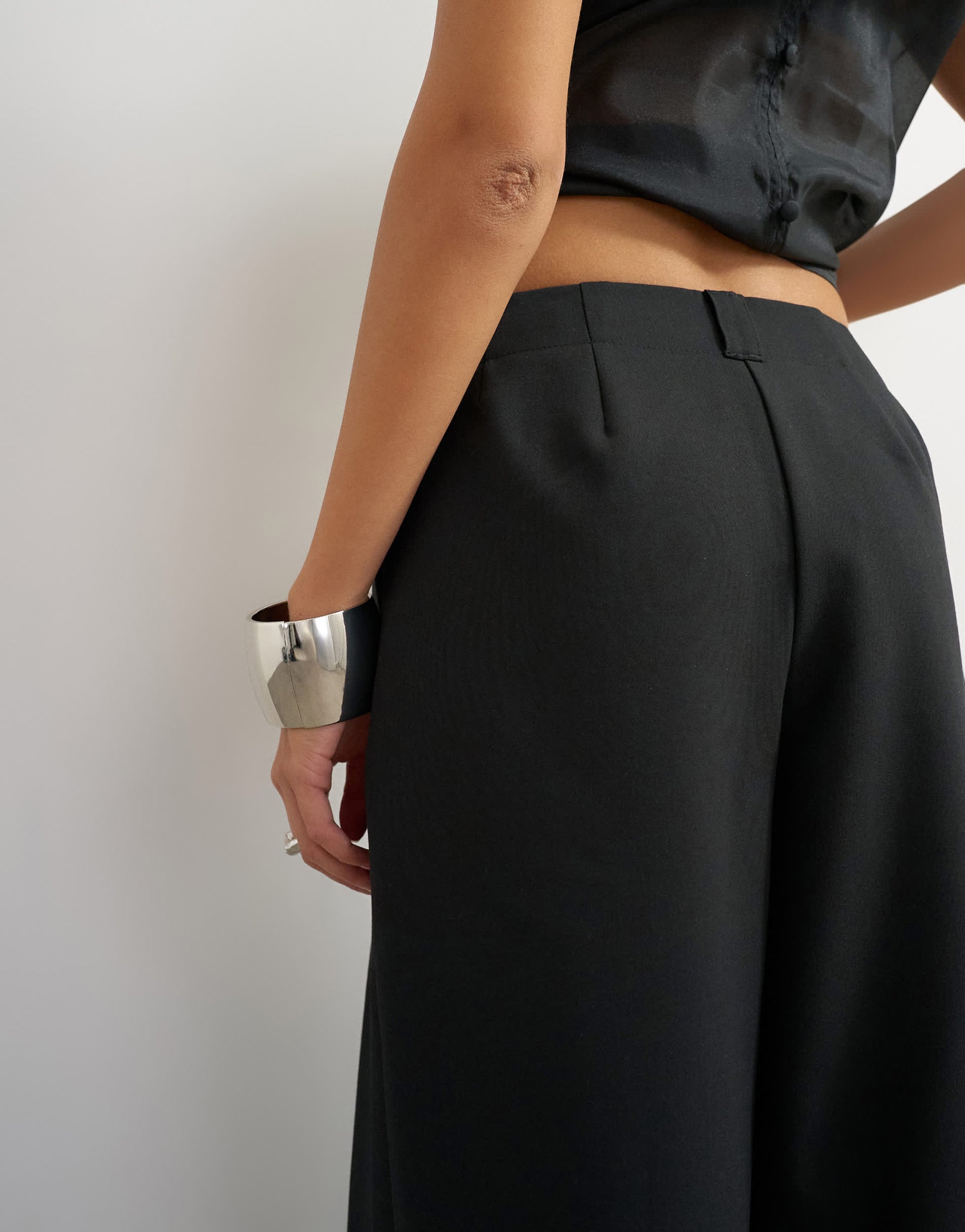 Topshop tailored pleat detail low rise wide leg trousers in black