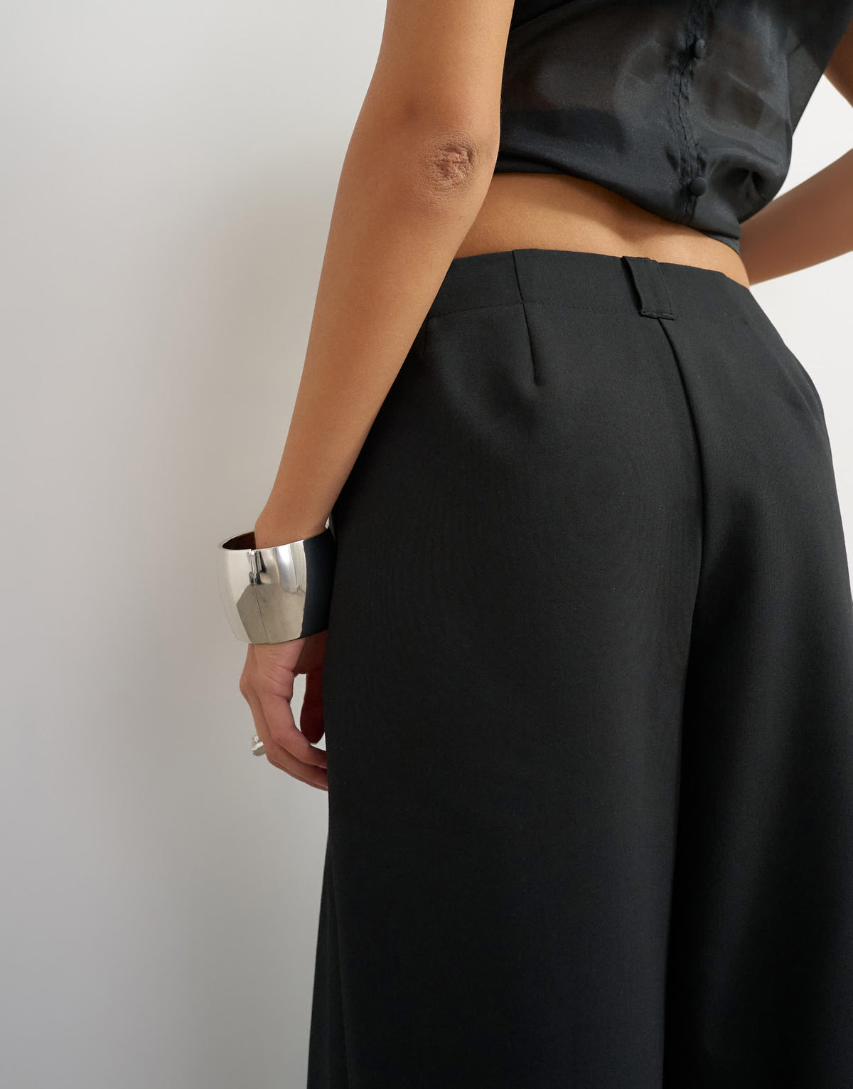 Topshop tailored pleat detail low rise wide leg trousers in black